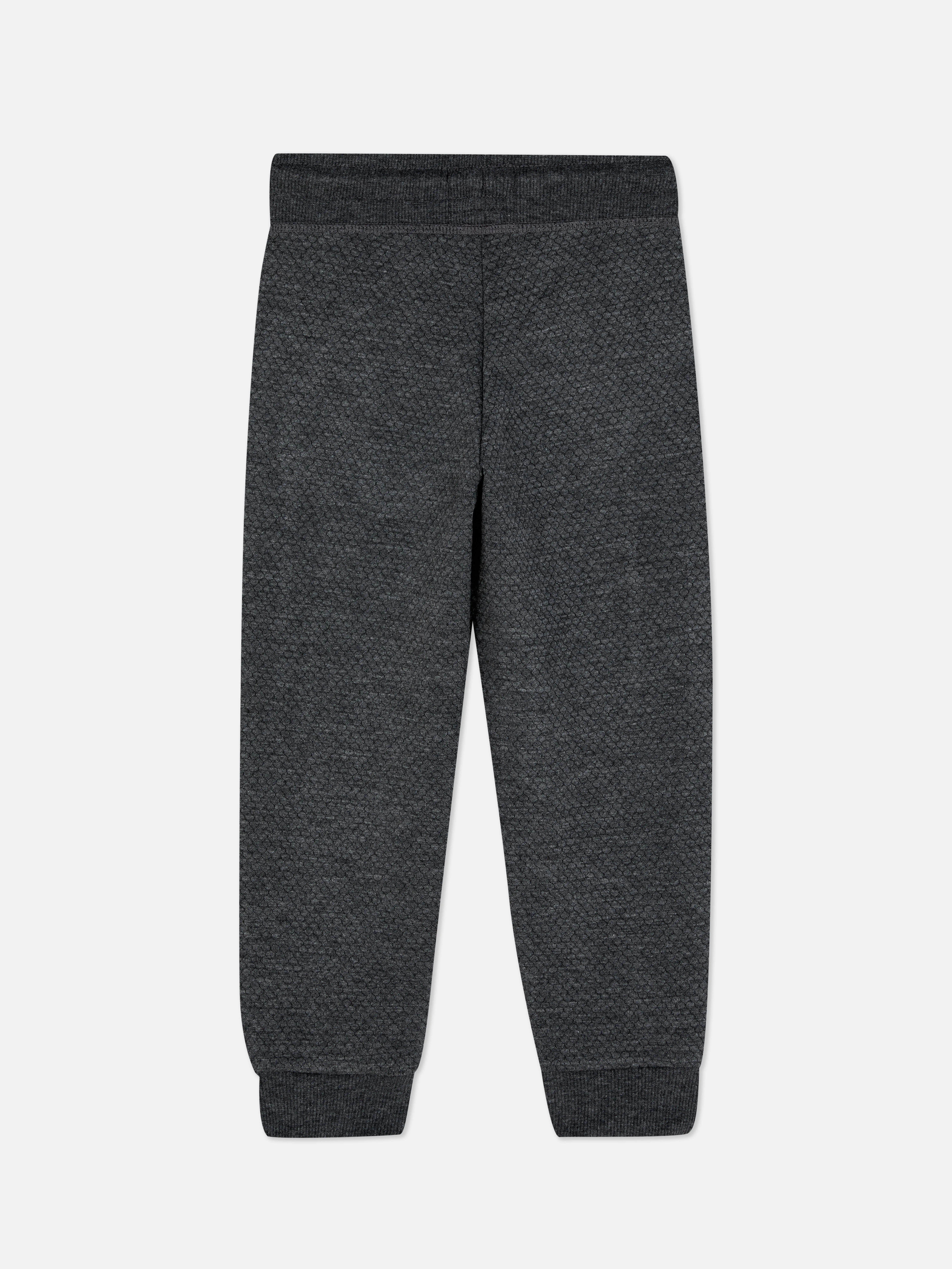 Joggers con textura y diseño geométrico
